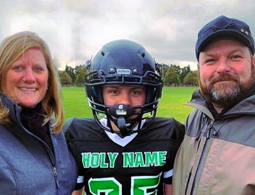 Troy, Tami & Isaac Sarles – Family from Marquette drawn to Holy Name